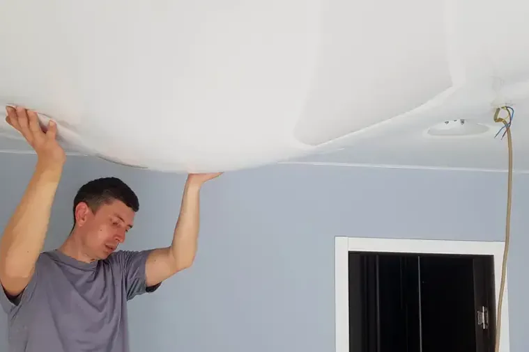 A ceiling sagging under water trapped by a leak above it