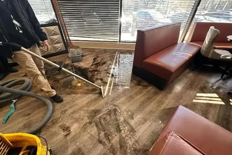 Water extraction on a restaurant floor during a commercial cleanup